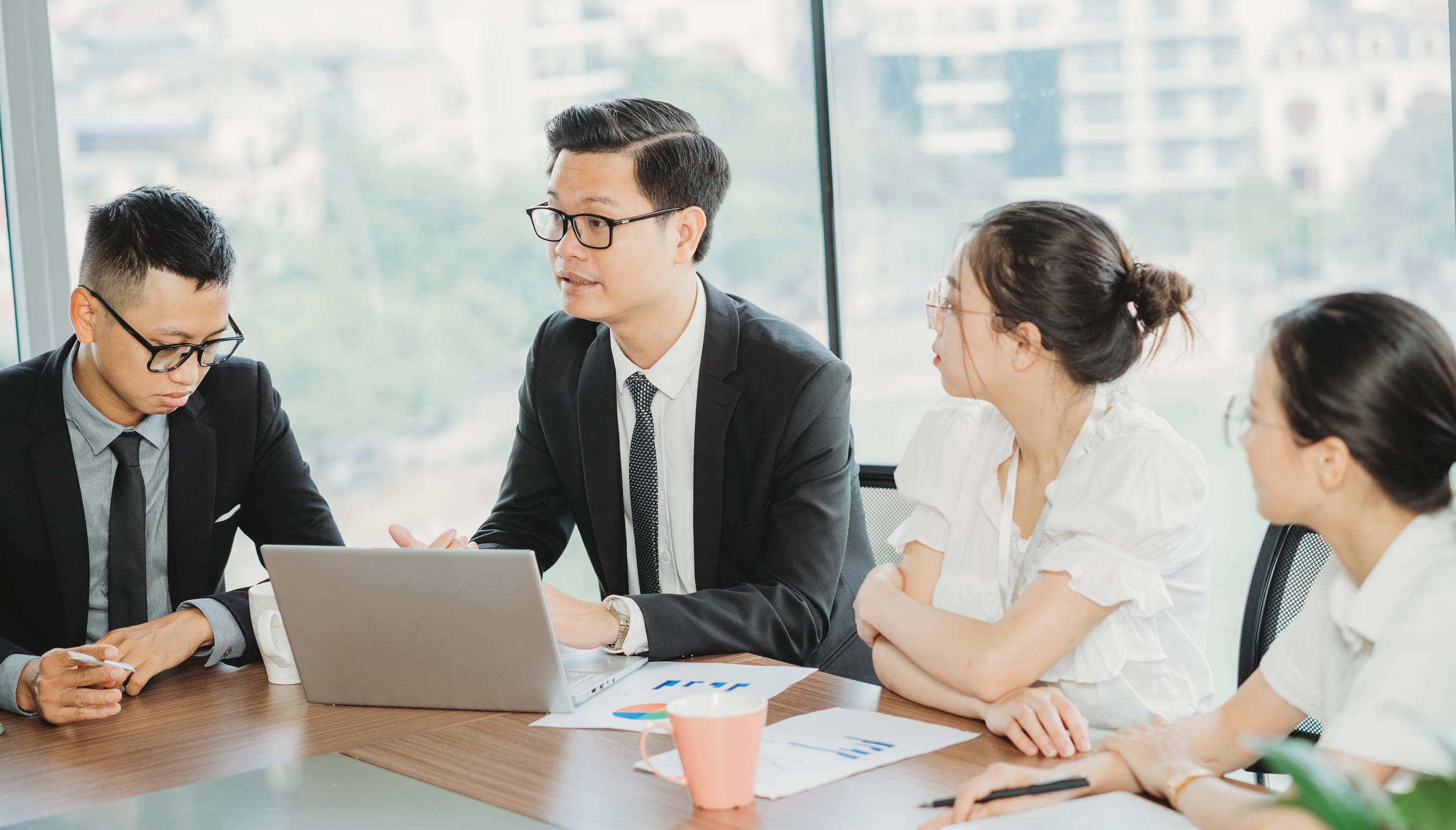 A group of business professionals discussing a project