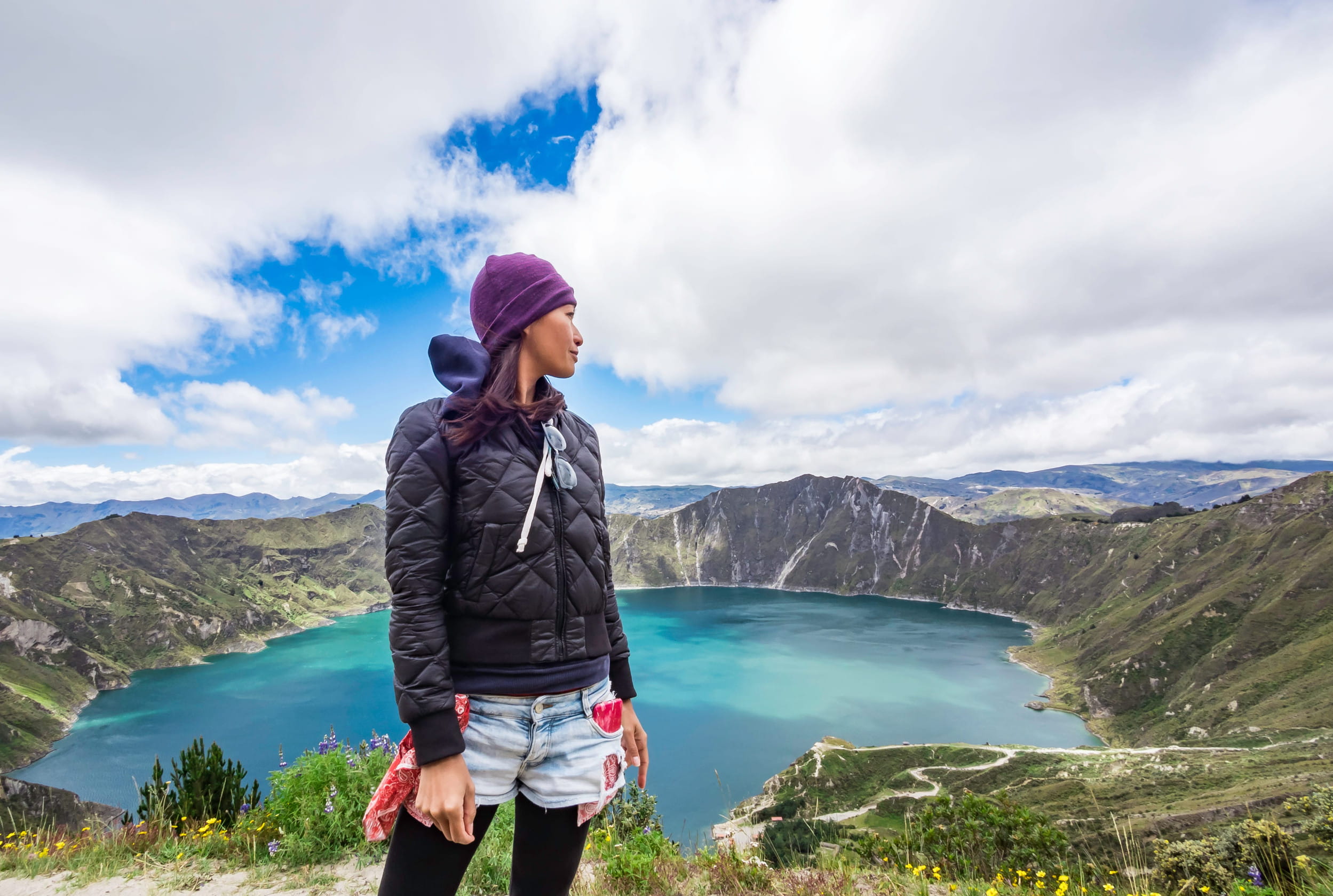 A woman looking at Quilotola Lake in Ecuador
