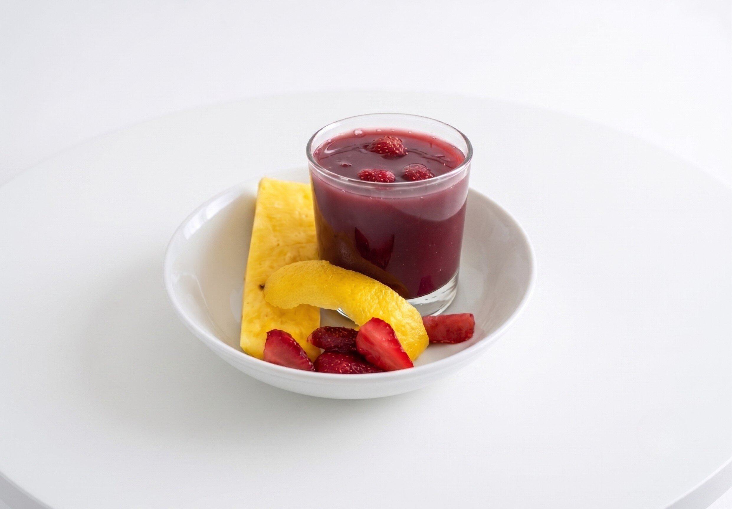 Colada Morada served with fruits