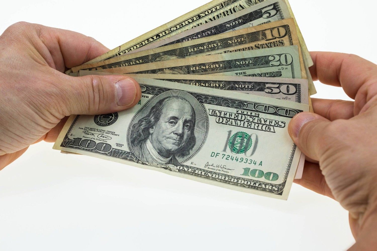 Holding Different Us Dollar Bills